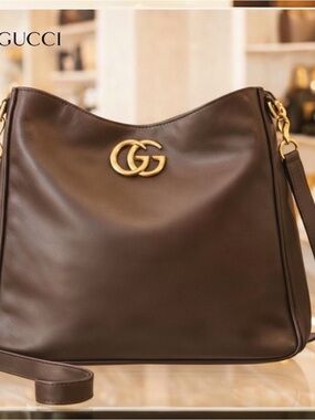 AUTHENTIC GUCCI HOBO BAG IF GODIVA MADE HANDBAGS THIS IS DARK CHOCOLATE.